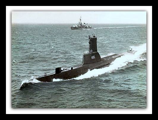 Sirago at sea with Tin Can in background